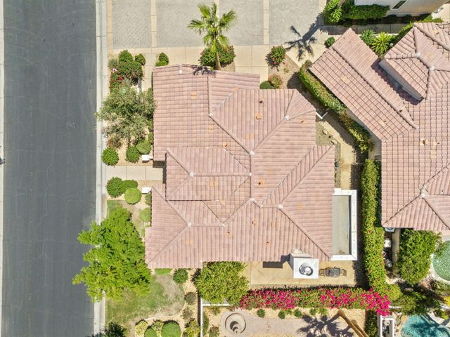 a view of front door and potted plants