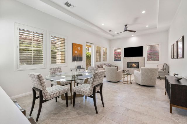 a view of a livingroom with workspace and a window