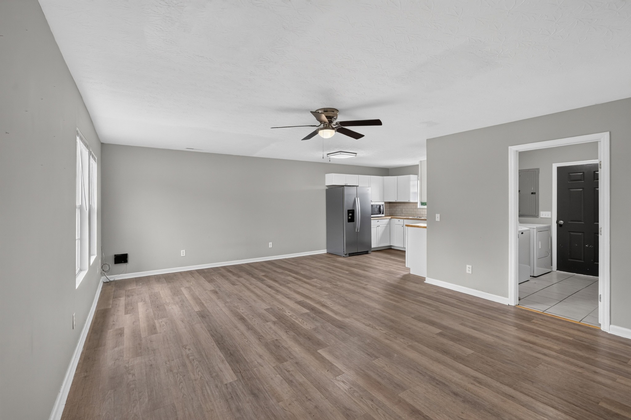 120 Driver Road Lafayette, TN 37083 - Photo 5 of 39 a view of empty room with wooden floor and ceiling fan