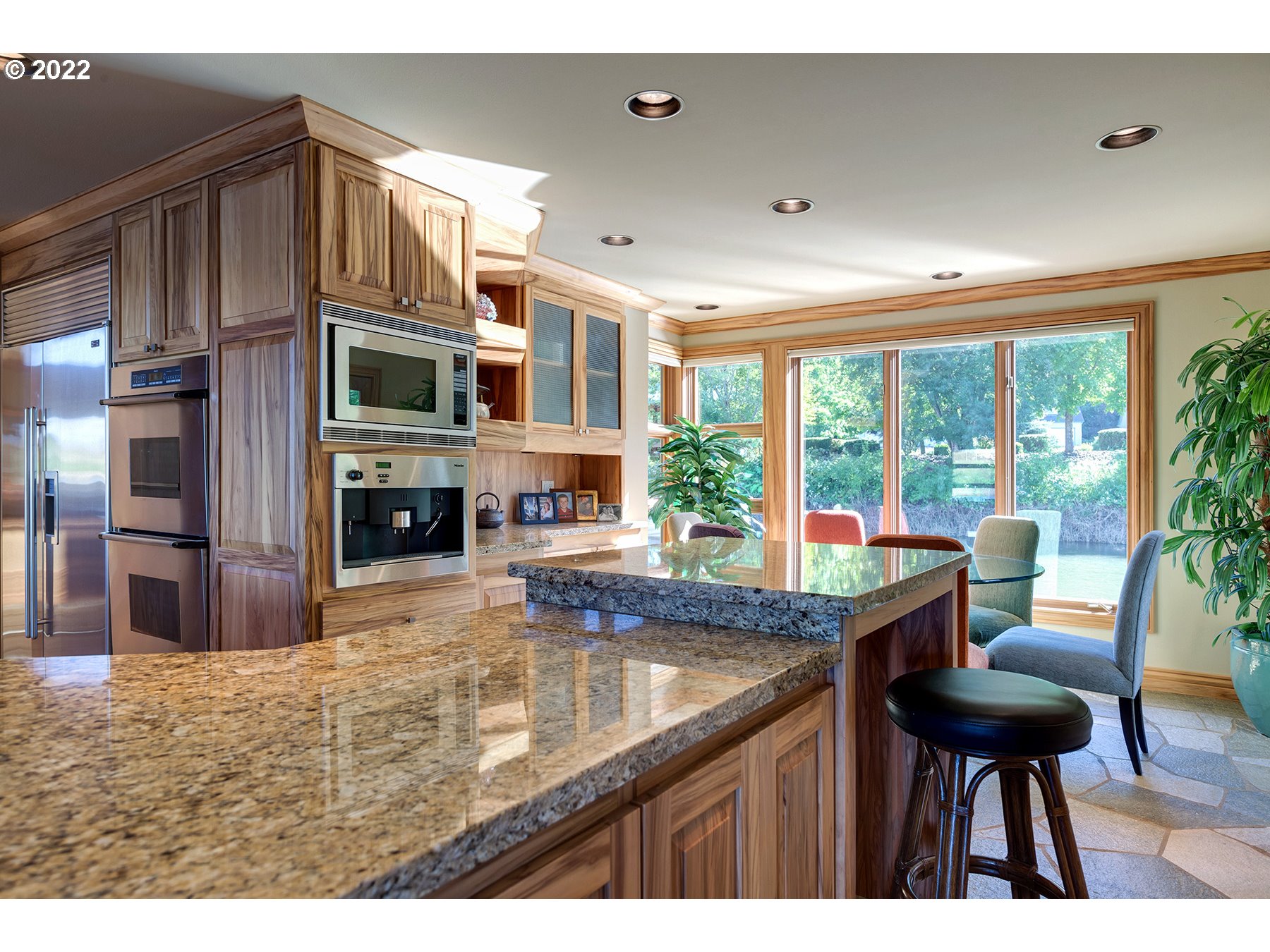 14561 Northwest Larson Road, Unit 16 17 Portland, OR 97231 - Photo 11 of 32 a kitchen with kitchen island a large window in it