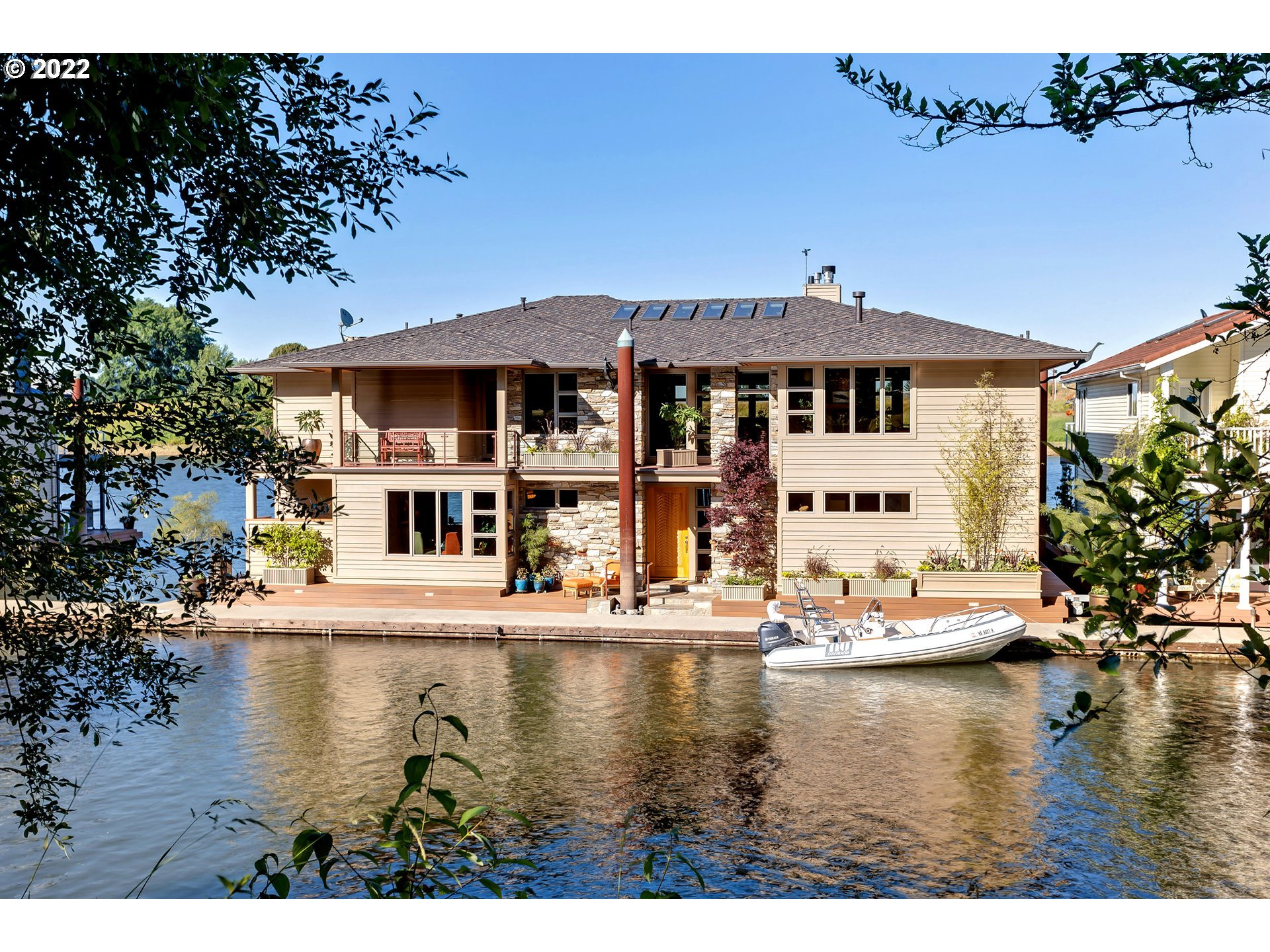 14561 Northwest Larson Road, Unit 16 17 Portland, OR 97231 - Photo 2 of 32 a view of a lake with house swimming pool and outdoor seating
