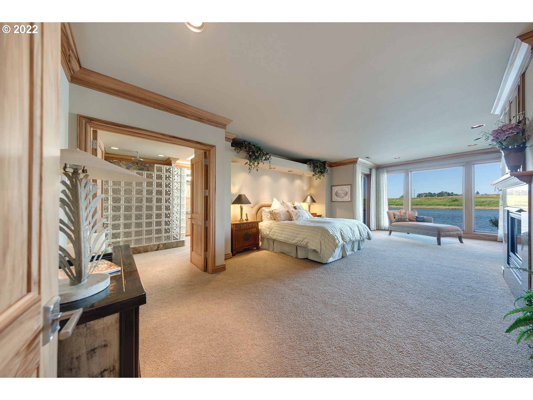 14561 Northwest Larson Road, Unit 16 17 Portland, OR 97231 - Photo 22 of 32 a bedroom with furniture and large windows