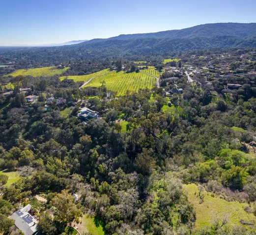 an aerial view of residential houses and outdoor space