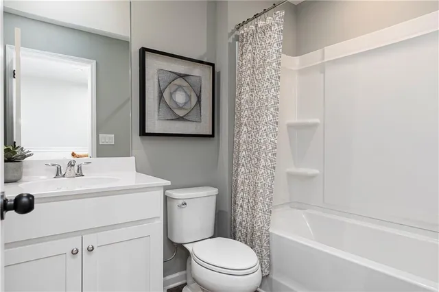 a bathroom with a toilet sink and a bathtub