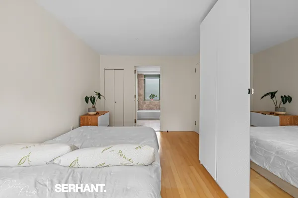 a bedroom with a bed and couch