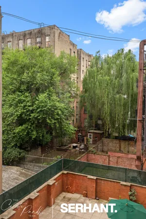 a view of a swimming pool with a yard