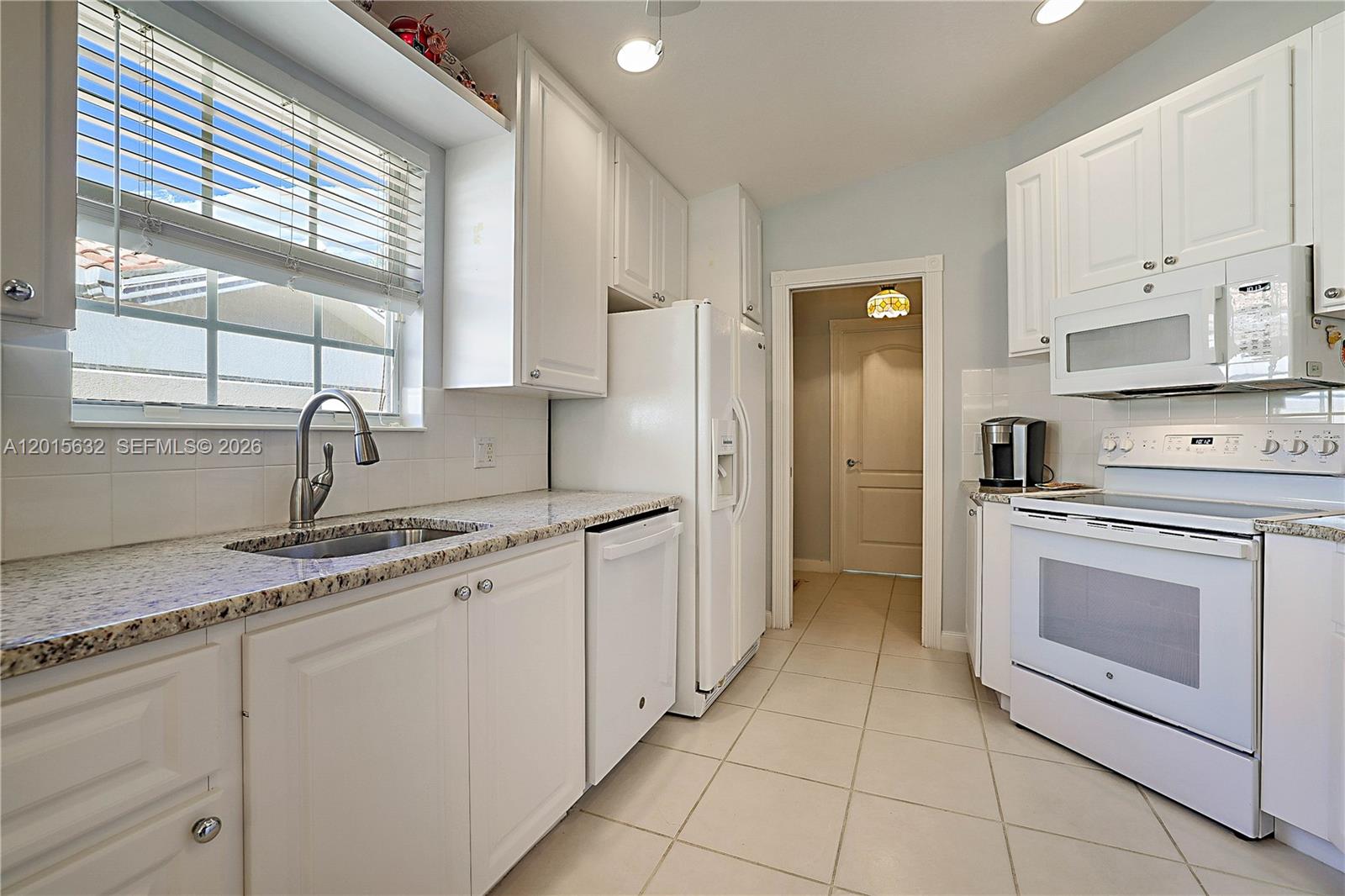 774 Southwest Balmoral Trace Stuart, FL 34997 - Photo 6 of 35 plenty of cupboards and a built-in pantry