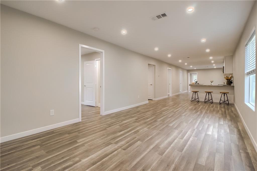 108 Irene Street Elgin, TX 78621 - Photo 4 of 22 a view of empty room with wooden floor