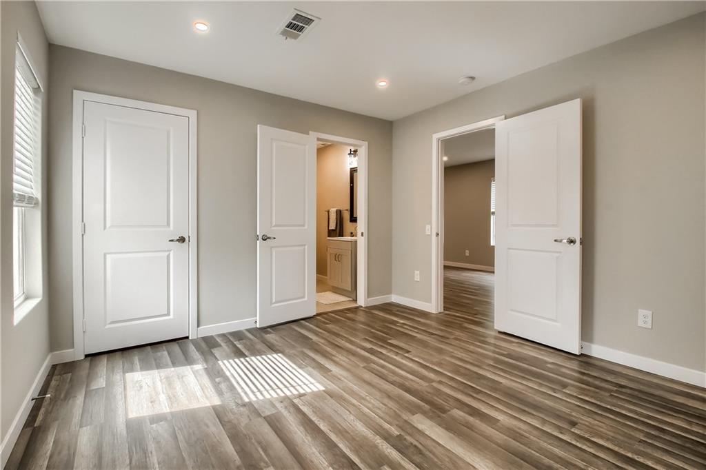 108 Irene Street Elgin, TX 78621 - Photo 9 of 22 an empty room with wooden floor & windows