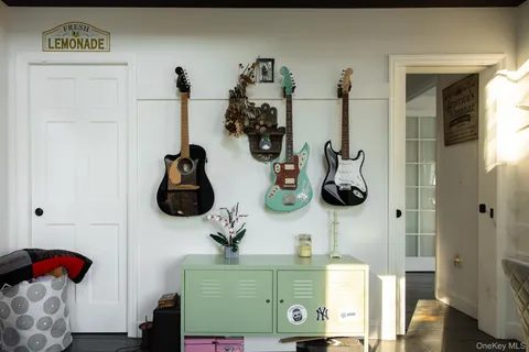 a balcony with wooden floor and furniture