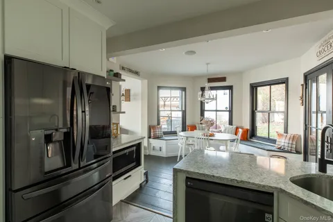 a kitchen with granite countertop lots of counter top space and stainless steel appliances