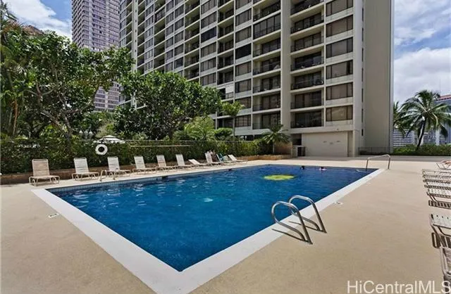a view of a swimming pool with a patio