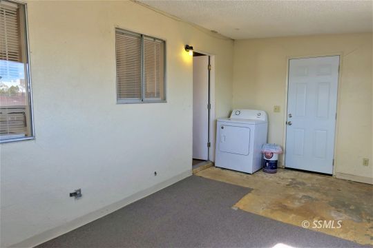 214 South Fire Opal Street Ridgecrest, CA 93555 - Photo 23 of 29 a room with closet and window