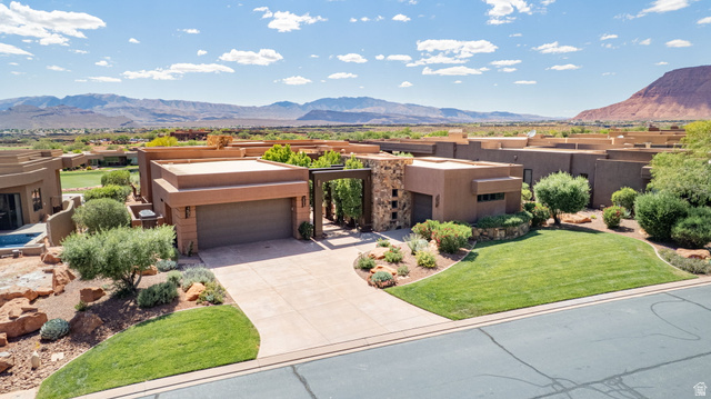 2331 West Entrada Trail, Unit 61 St. George, UT 84770 - Photo 61 of 69 Desert modern architecture featuring a stone facade and stucco exterior