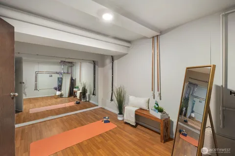a room with a bed and a mirror
