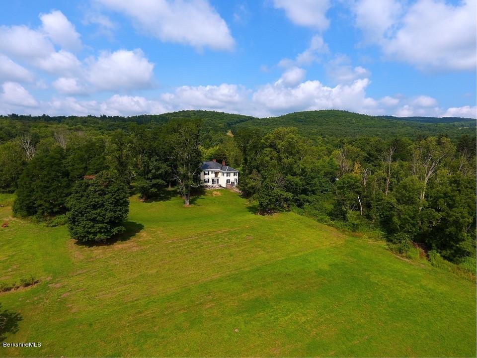 1385 State Road Richmond, MA 01254 - Photo 5 of 25 a view of a lake with a houses