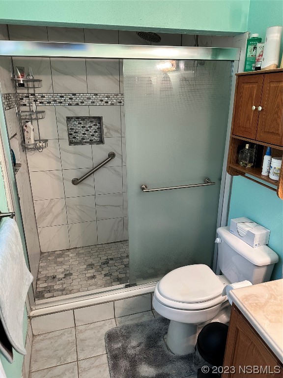 2502 Umbrella Tree Drive Edgewater, FL 32141 - Photo 12 of 26 a bathroom with a toilet and a shower