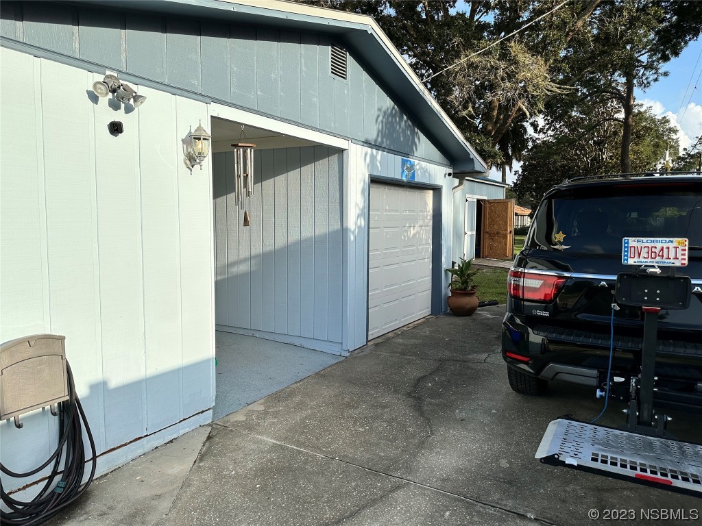 2502 Umbrella Tree Drive Edgewater, FL 32141 - Photo 20 of 26 a view of car garage