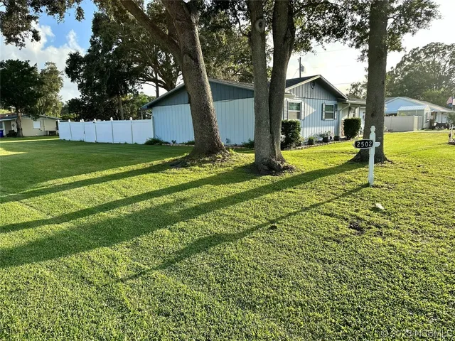a view of a house with a big yard