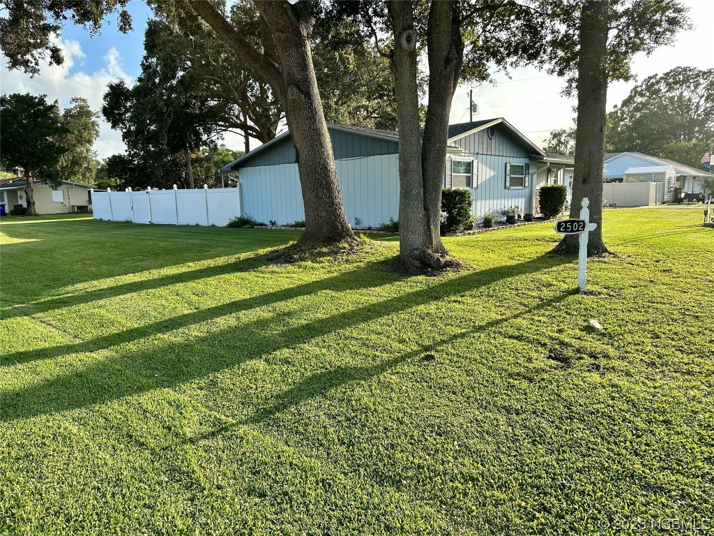 2502 Umbrella Tree Drive Edgewater, FL 32141 - Photo 2 of 26 a view of a house with a big yard