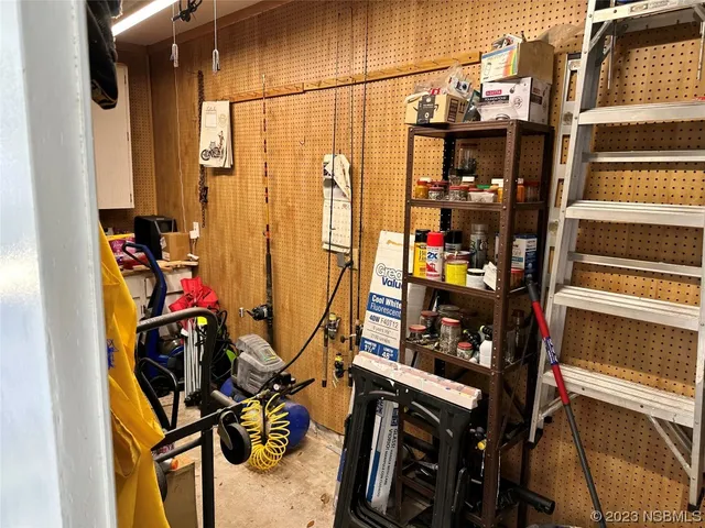 walk in closet with wooden floor