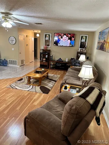 a kitchen with stainless steel appliances a stove microwave and sink