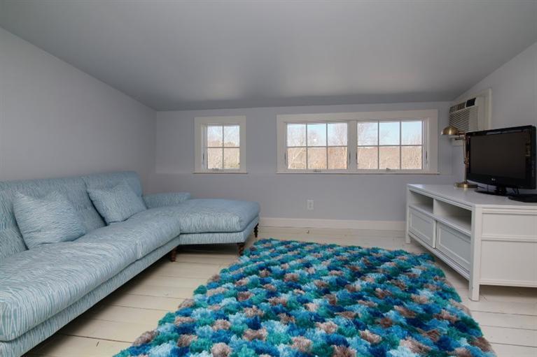 150 Sea View Avenue Osterville, MA 02655 - Photo 19 of 26 a living room with furniture and a flat screen tv