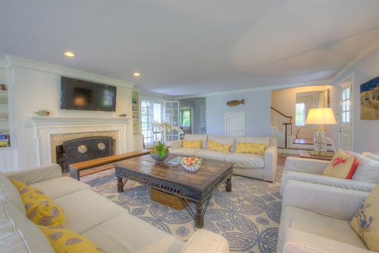 150 Sea View Avenue Osterville, MA 02655 - Photo 6 of 26 a living room with furniture a fireplace and a flat screen tv