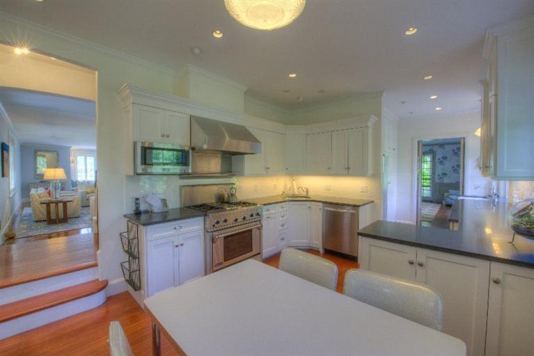 150 Sea View Avenue Osterville, MA 02655 - Photo 7 of 26 a kitchen with kitchen island granite countertop a sink counter top space appliances and cabinets