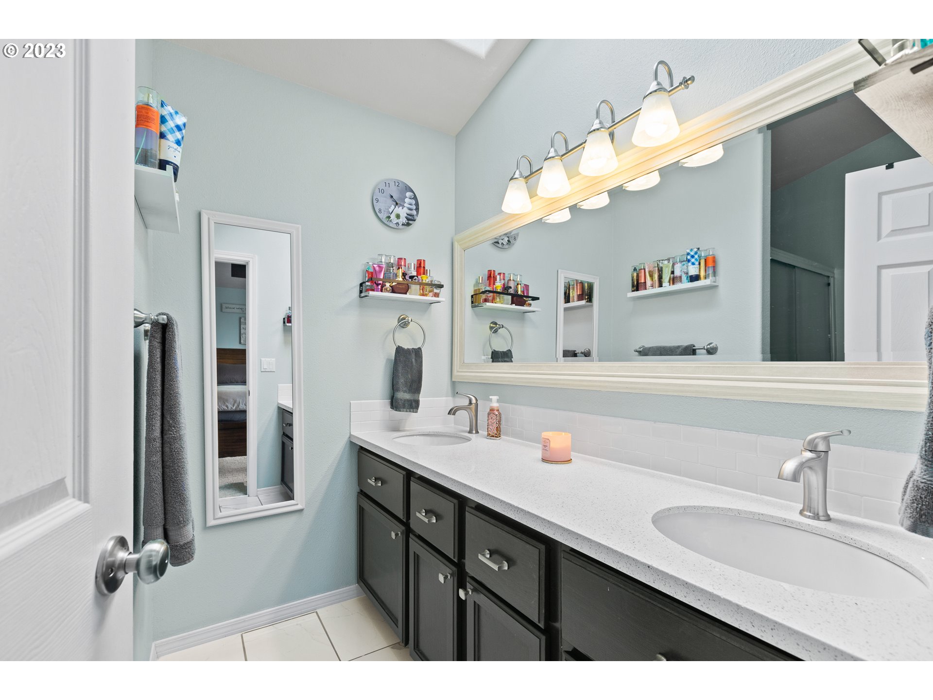 3659 Southeast 10th Street Gresham, OR 97080 - Photo 14 of 34 a bathroom with a sink double vanity and a mirror