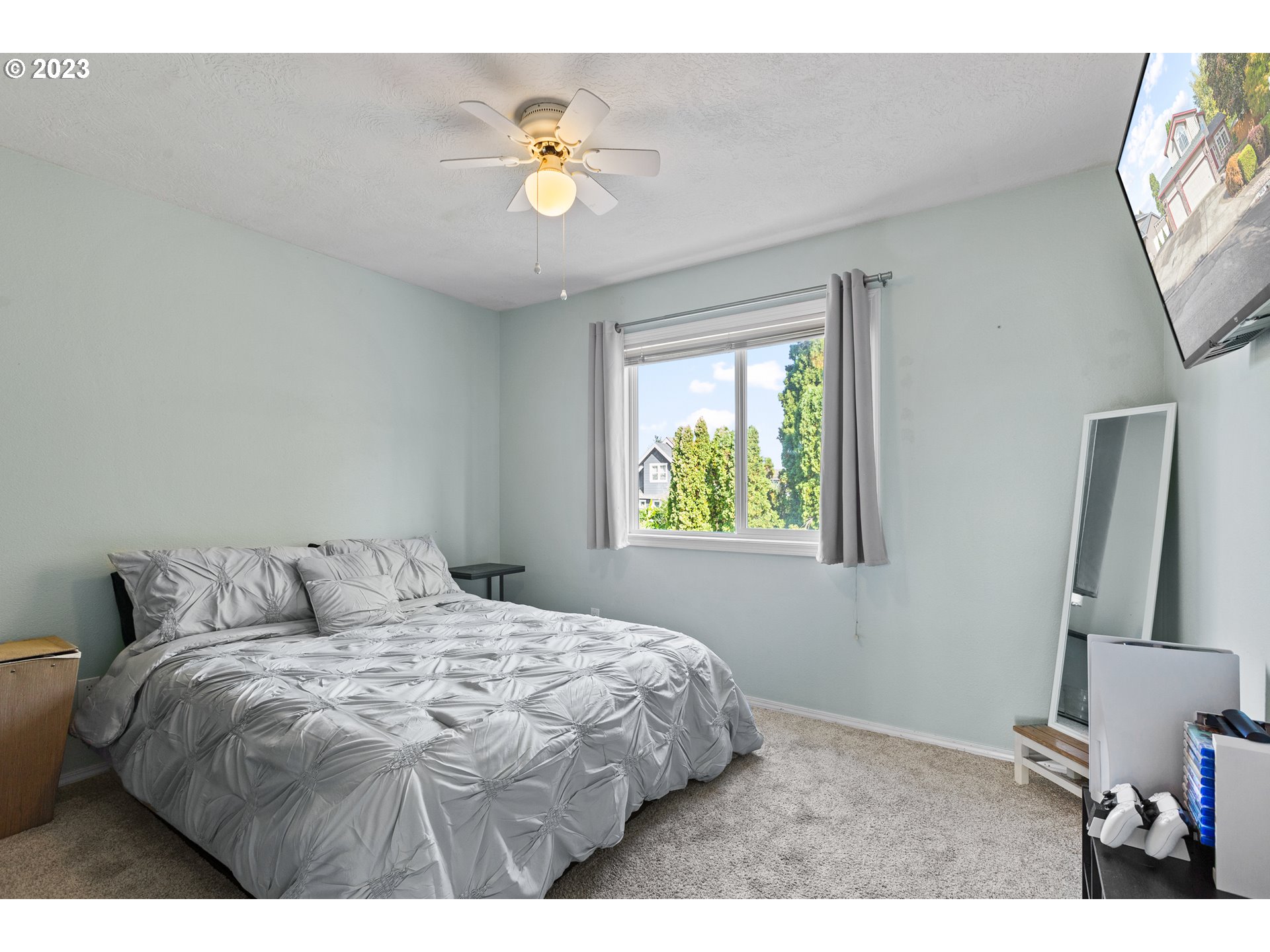 3659 Southeast 10th Street Gresham, OR 97080 - Photo 16 of 34 a bedroom with a bed and a window