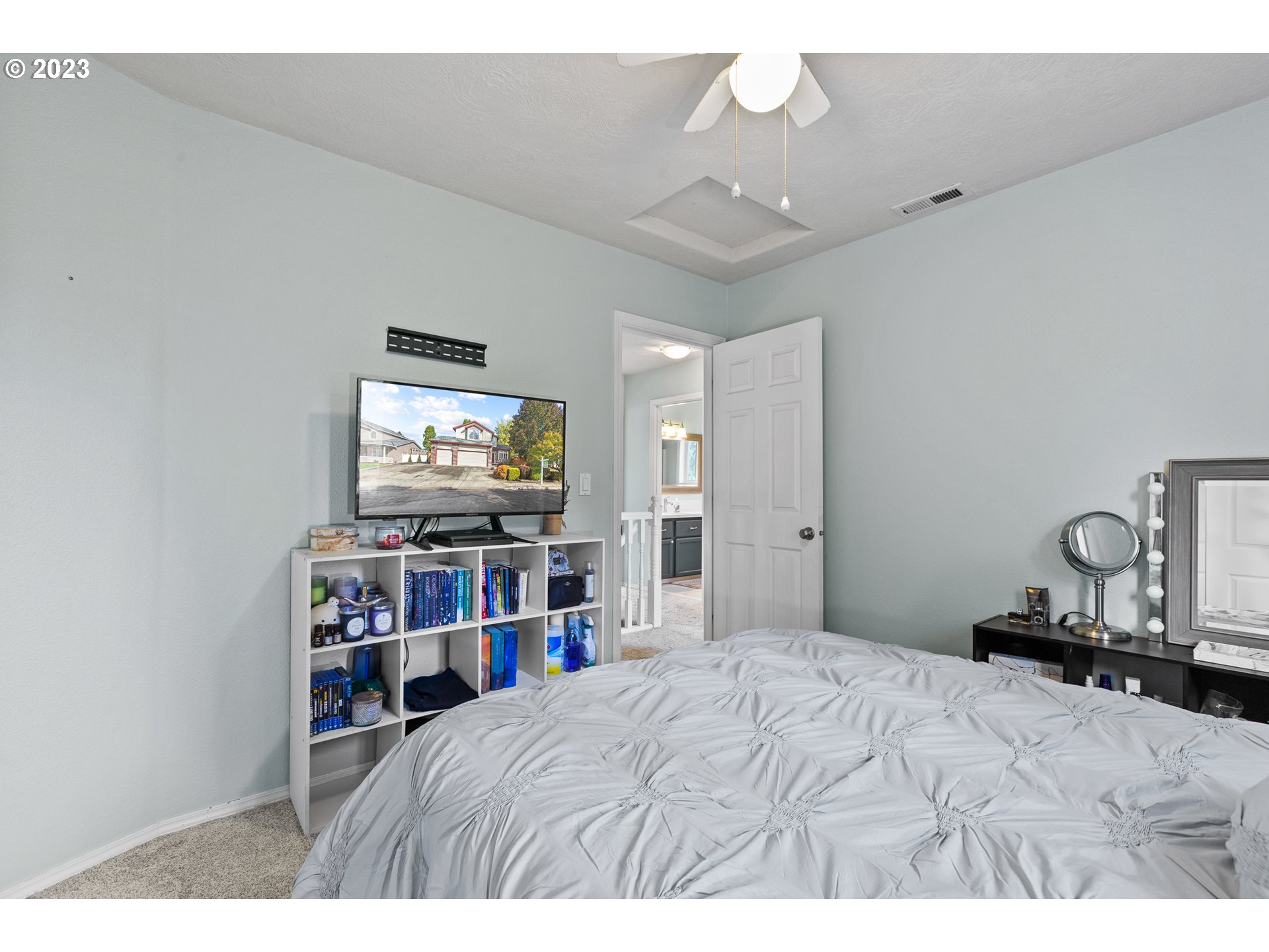 3659 Southeast 10th Street Gresham, OR 97080 - Photo 18 of 34 a bedroom with a bed and a flat screen tv