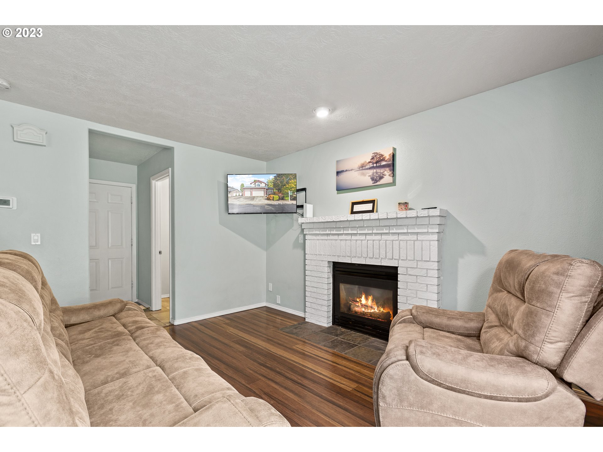 3659 Southeast 10th Street Gresham, OR 97080 - Photo 22 of 34 a bedroom with furniture and a fireplace