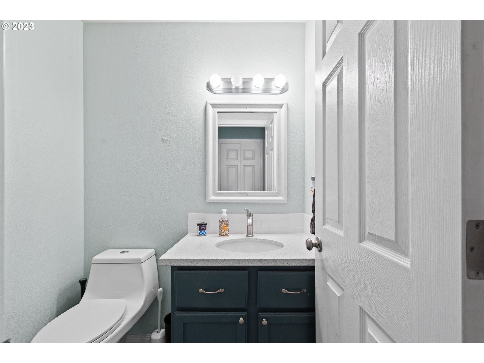 3659 Southeast 10th Street Gresham, OR 97080 - Photo 23 of 34 a bathroom with a sink vanity and a mirror