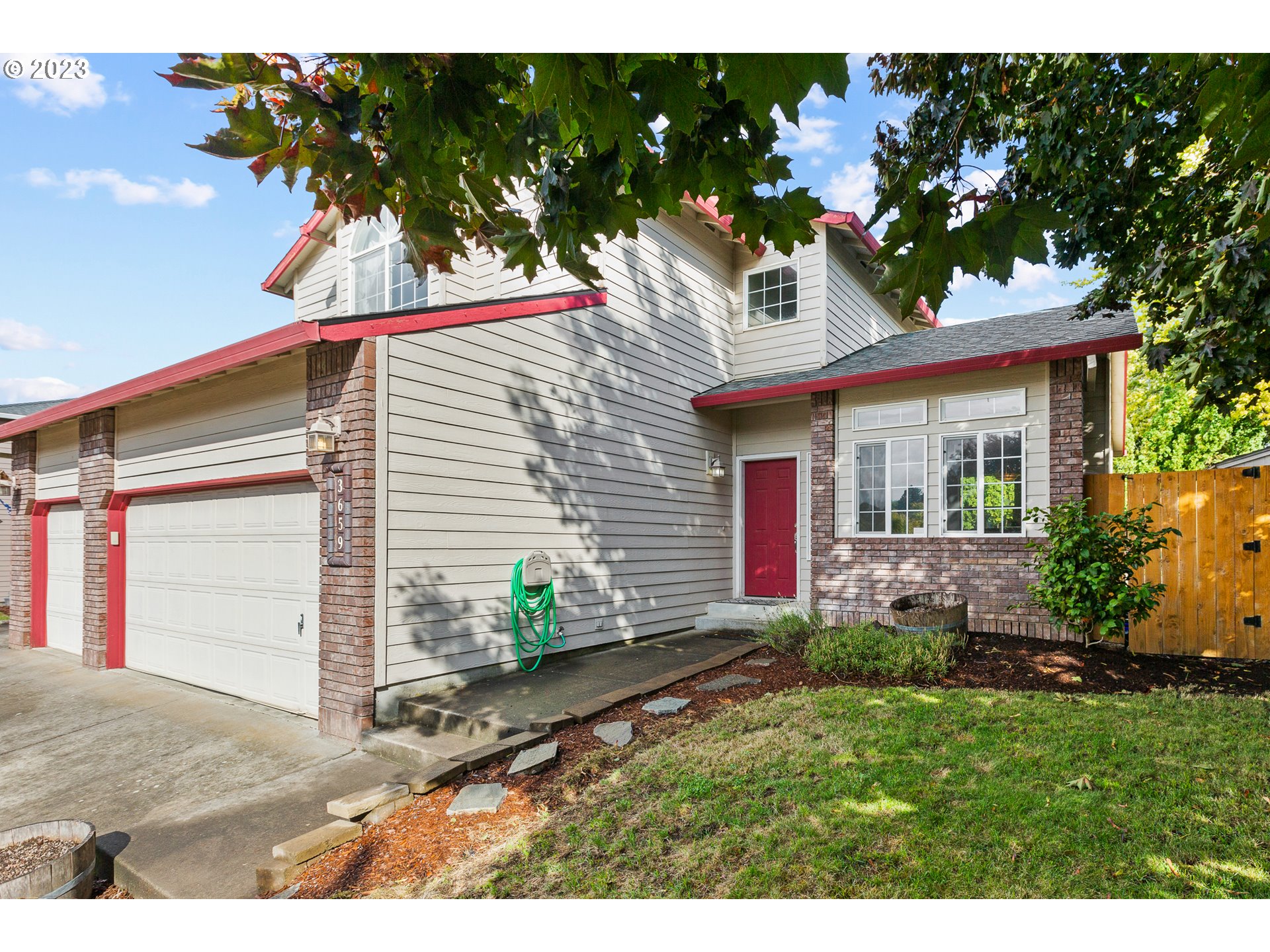 3659 Southeast 10th Street Gresham, OR 97080 - Photo 3 of 34 a view front of house with a yard and potted plants
