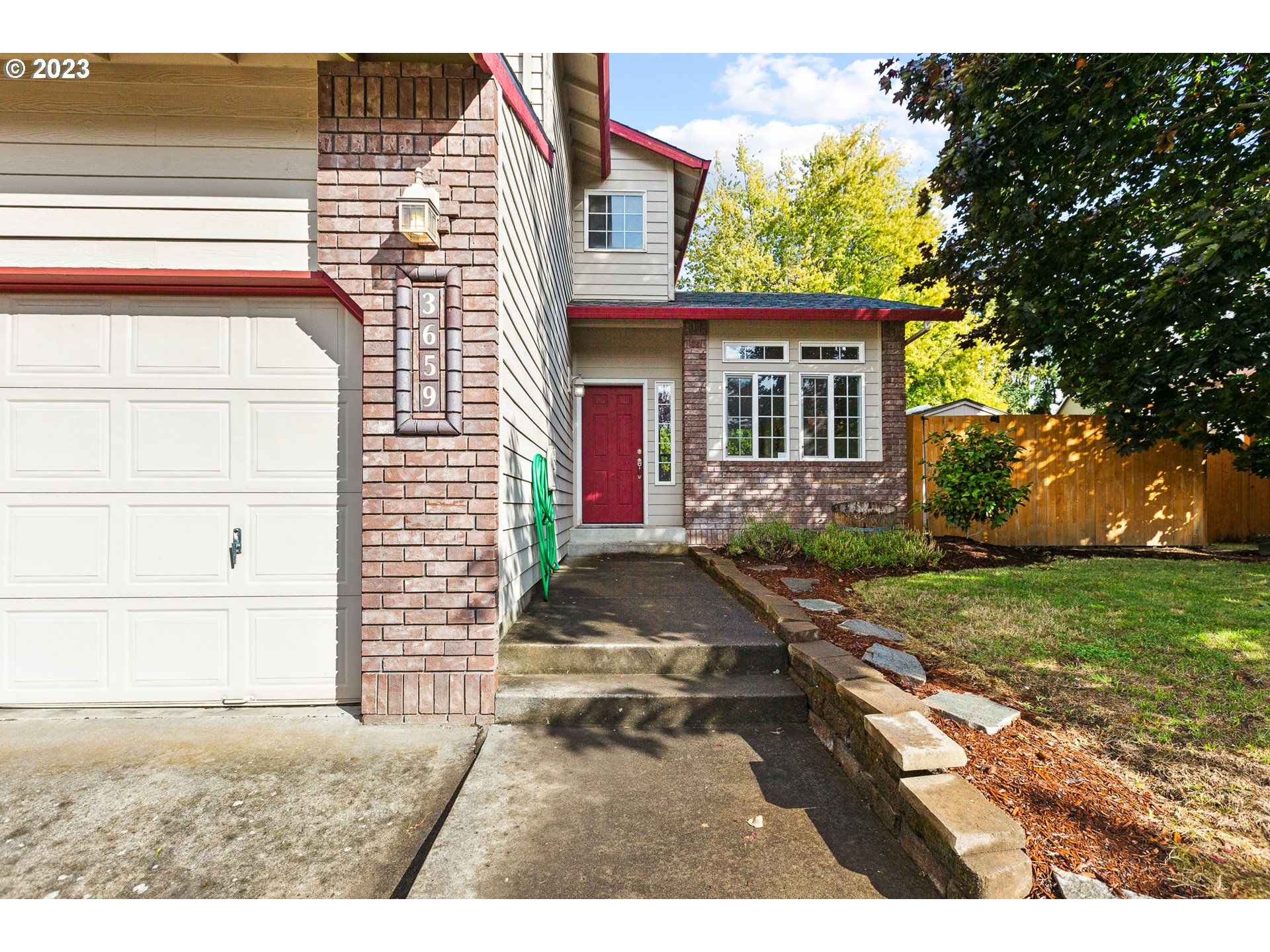 3659 Southeast 10th Street Gresham, OR 97080 - Photo 4 of 34 a view of a house with a yard
