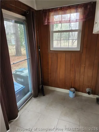 a metallic refrigerator freezer sitting in a kitchen