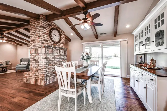 a large kitchen with stainless steel appliances kitchen island granite countertop a large counter top cabinets and wooden floor