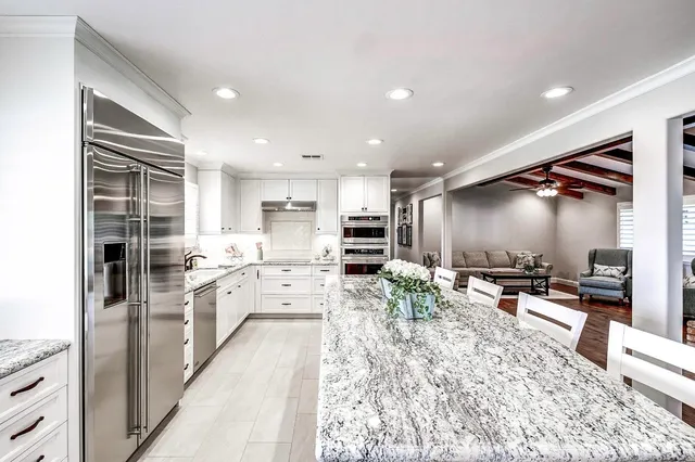 a spacious bedroom with a bed and window