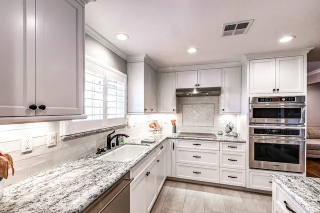 a spacious bedroom with a bed and window