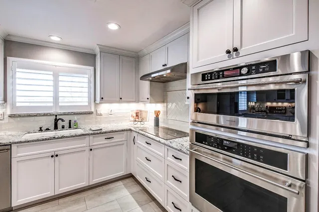 a view of walk in closet with clothes