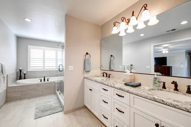 a bed room with furniture and a flat screen tv