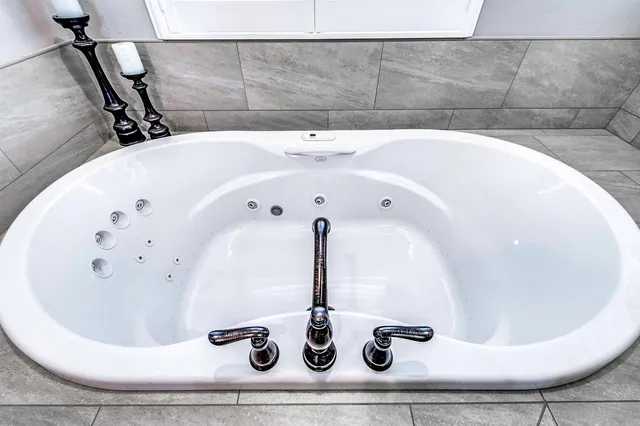 a view of a house with a yard and a large window