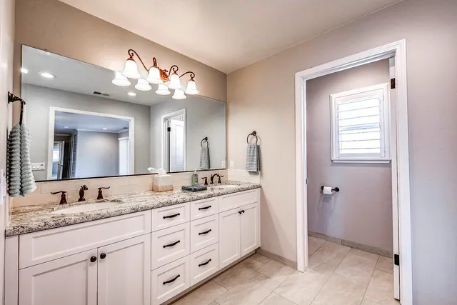 a view of an empty room with windows