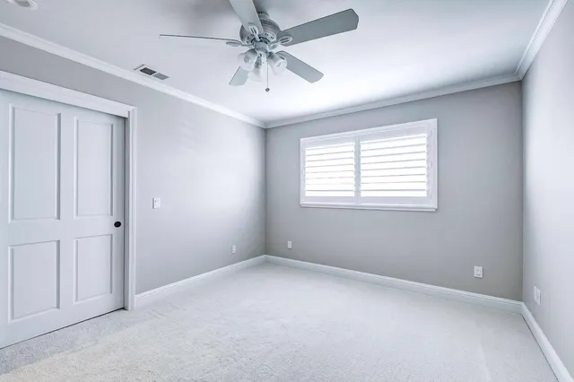 a view of a backyard with swimming pool