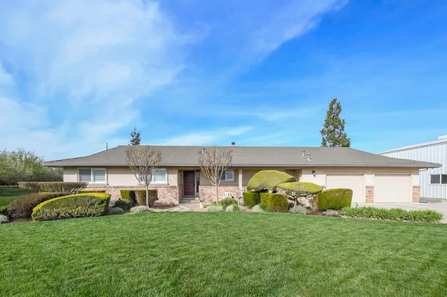 a front view of a house with many windows