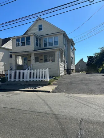 a front view of a house with fence