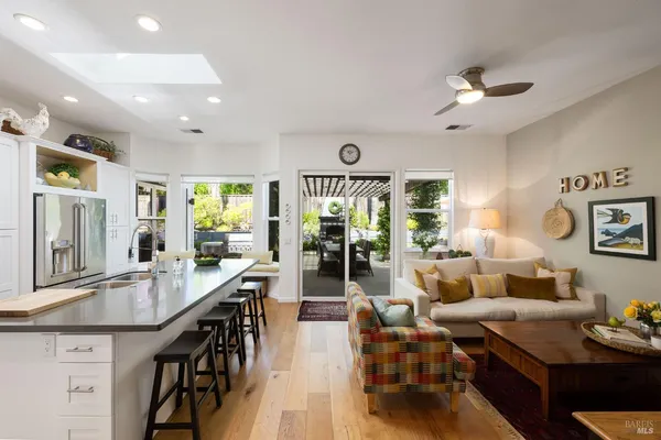 a kitchen with sink refrigerator and stove