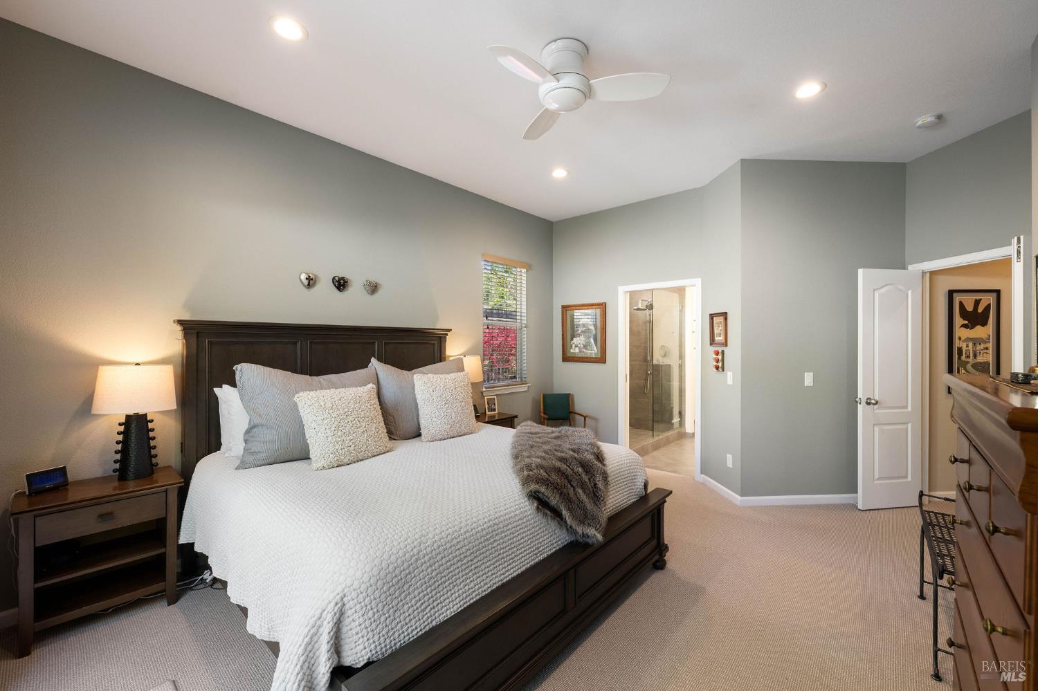 806 Chiles Avenue St. Helena, CA 94574 - Photo 17 of 38 a bedroom with a bed and a chandelier