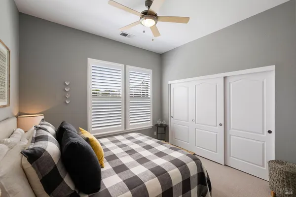 a bed room with a bed and a window